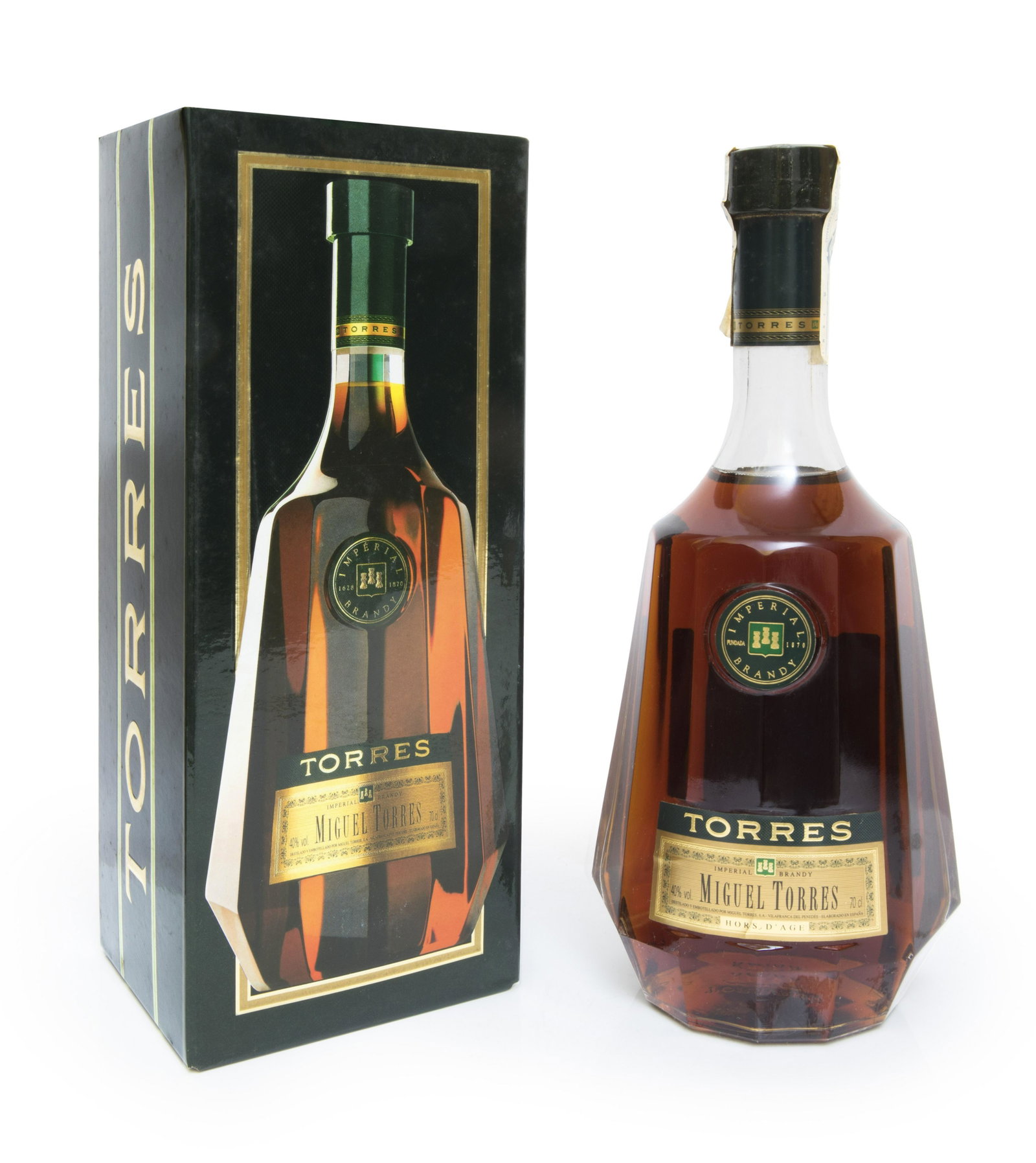 A bottle of Miguel Torres, Brandy Imperial Hors dÂ´Age.: A bottle of Miguel Torres, Brandy Imperial Hors dÂ´Age. Category: brandy. Level: C.Brandy made from Parellada and Ugni Blanc grapes and aged in Limousin oak barrels. The bottle is inspired by their 