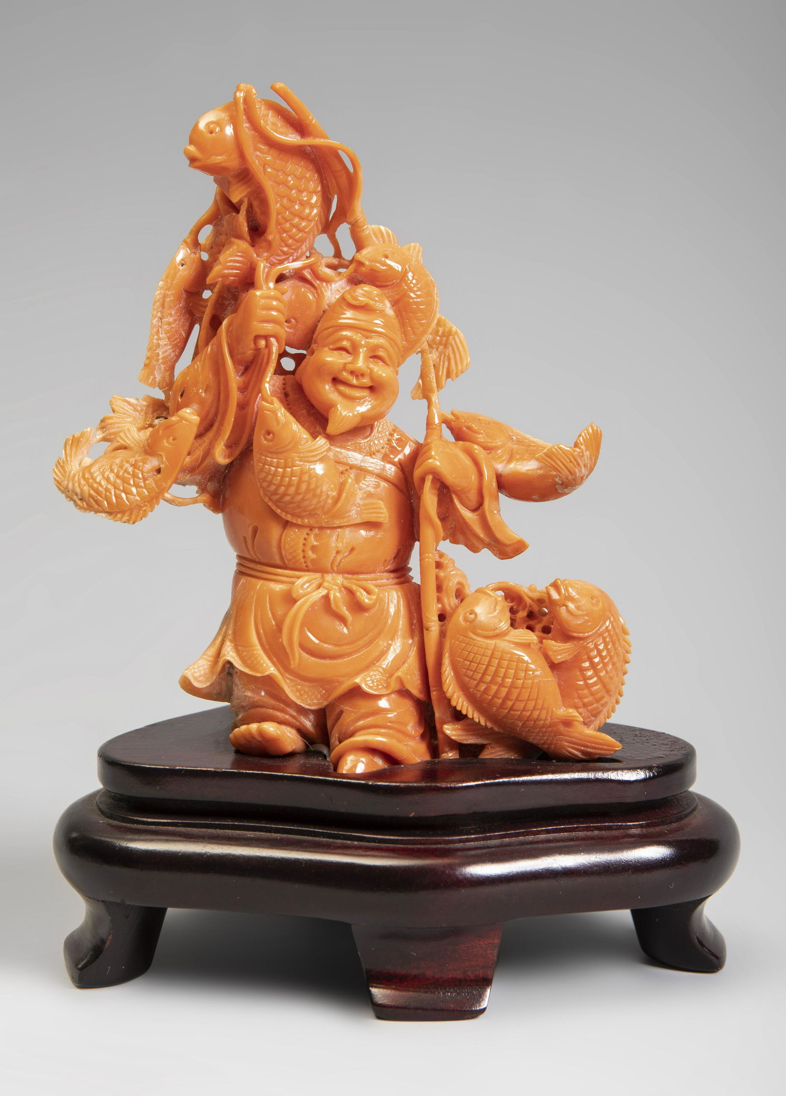 Ebisu. China, 20th century.  Coral.  On wooden base. (1 of 3)