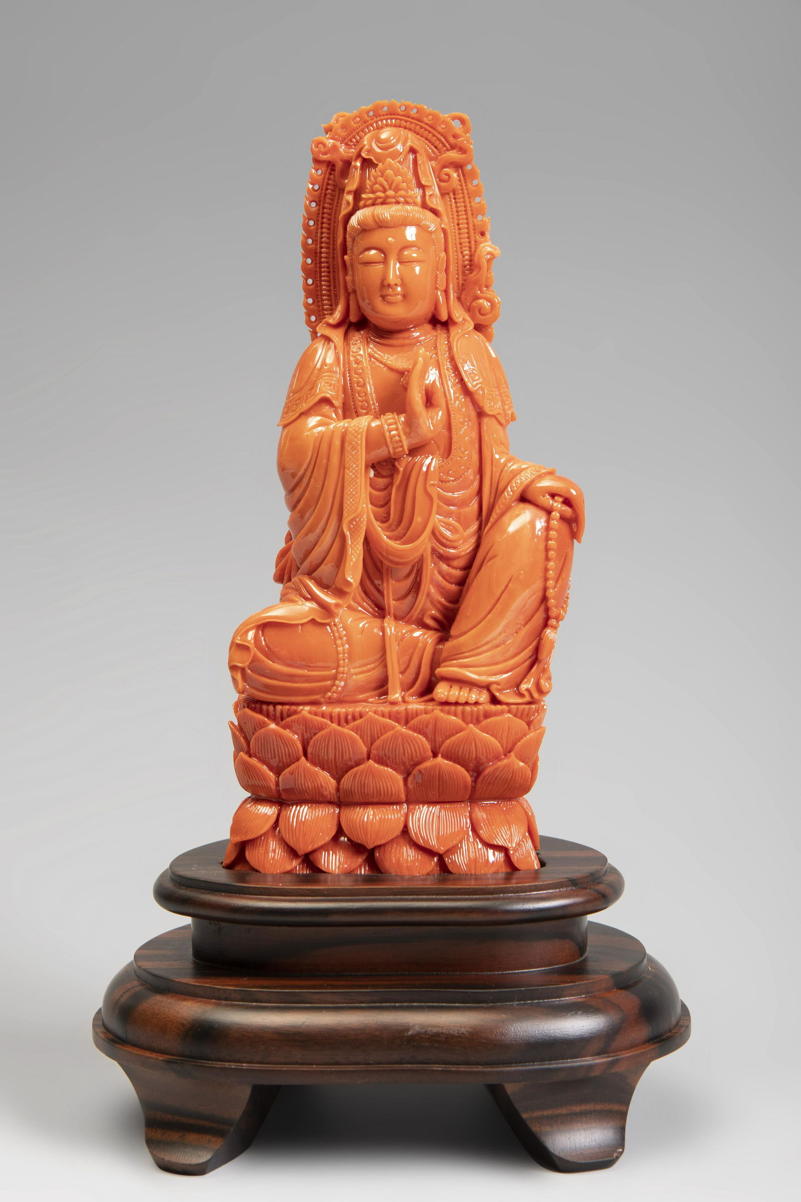 Guanyin sitting. China, 20th century.  Coral. (1 of 3)