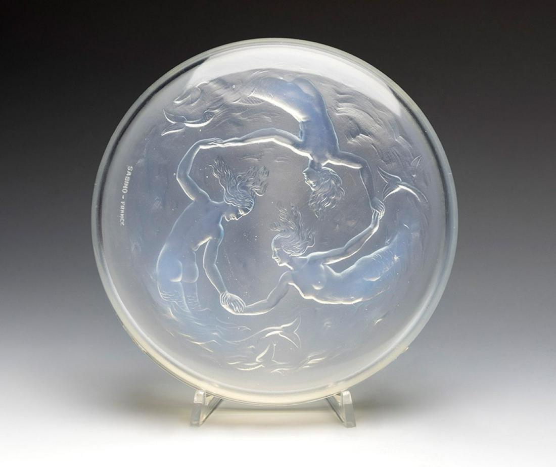 MARIUS ERNEST SABINO, France, ca.1930. Art Deco box. Moulded and carved glass with scene of: MARIUS ERNEST SABINO, France, ca.1930. Art Deco box. Moulded and carved glass with scene of mermaids. Signed "Sabino, France" on the side. Measures: 4,5 x 20 x 20 cm. Box made of moulded glass, carved