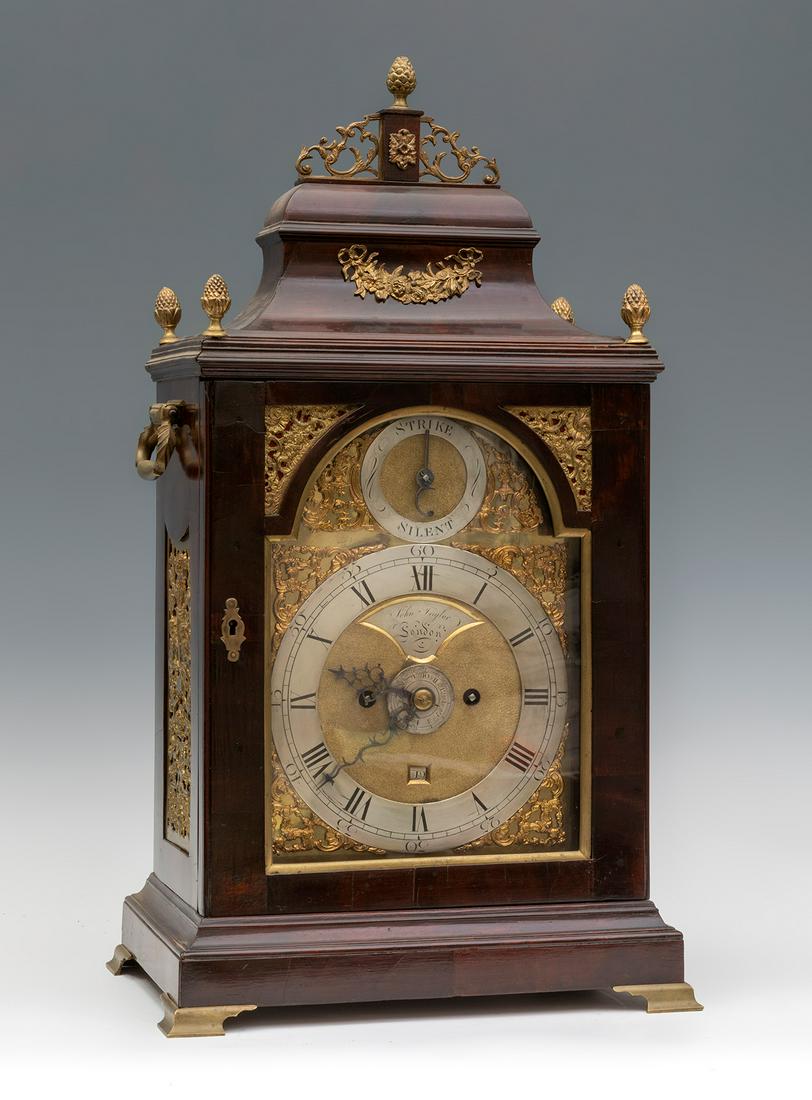 George III Bracket Clock, signed JOHN TAYLOR. London, third quarter of the 18th century. Mahogany: George III Bracket Clock, signed JOHN TAYLOR. London, third quarter of the 18th century. Mahogany veneered case with gilt bronze appliques. Gilt dial with gilt bronze spandrels, month calendar and str
