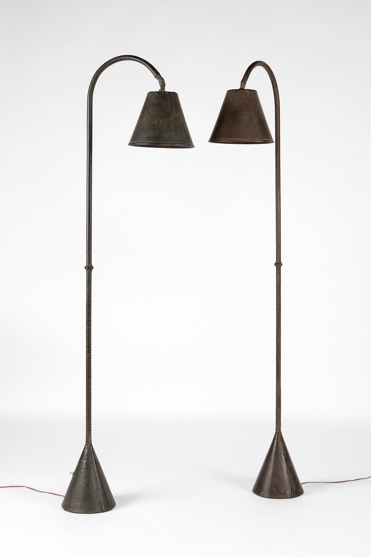Pair of floor lamps from the 1940s. Metal covered in leather. Bulbs still intact. (1 of 7)