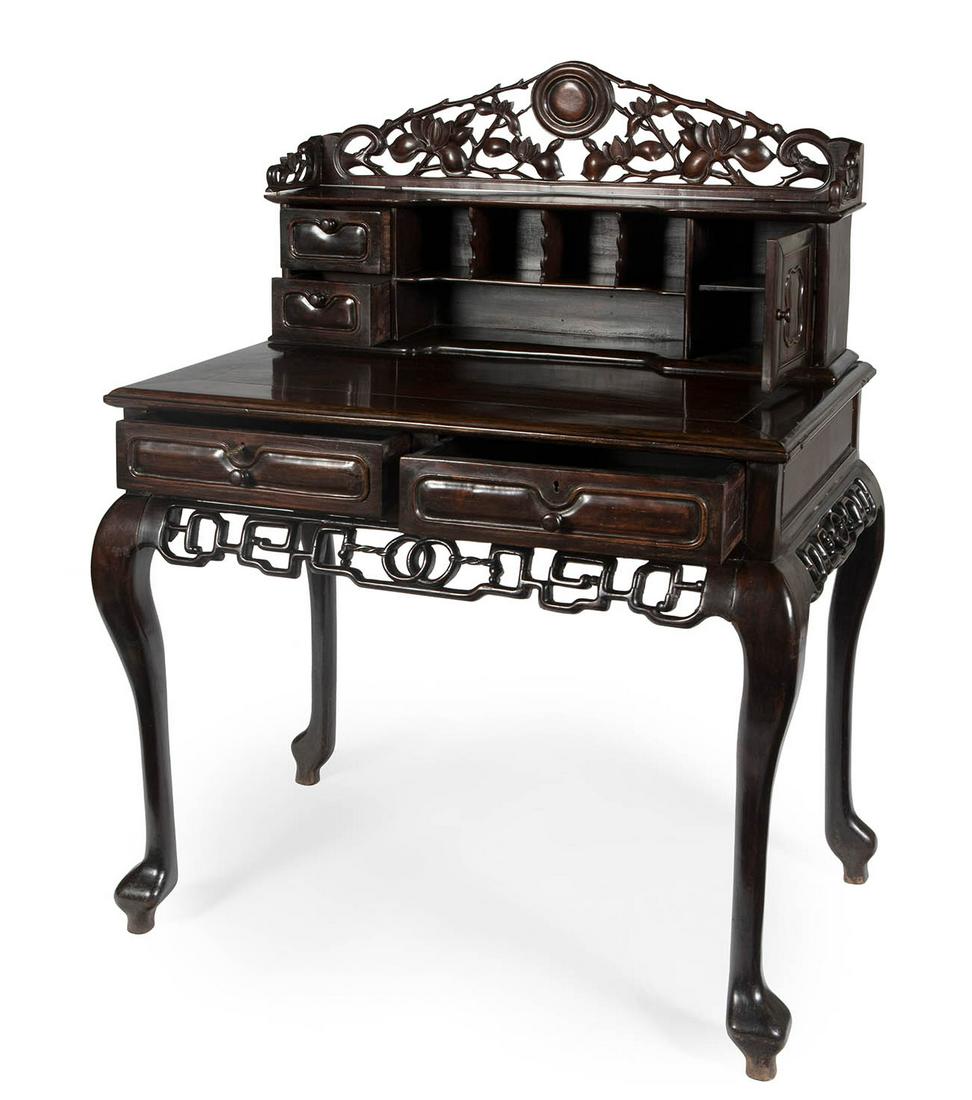 Desk. Hong Kong, second half of the 19th century. Hongmu wood. Signed on the drawer locks.: Desk. Hong Kong, second half of the 19th century. Carved Hongmu wood. Signed on the locks of the drawers. Measurements: 123 x 95 x 56 cm. Desk made entirely of Hongmu wood, a material that allows Chin