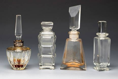 Four Art Deco perfume bottles. France ca. 1940. Moulded glass. Provenance: Spanish private: Four Art Deco perfume bottles. France ca. 1940. Moulded glass. Provenance: Spanish private collection, formed between 1970 and 1995. Measurements: 14,5 x 5,5 x 4,5 cm (largest). Set of four