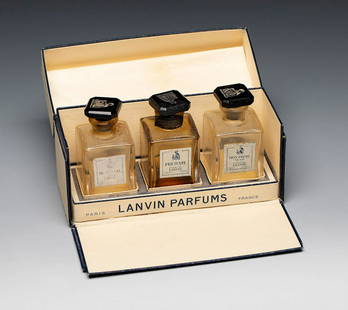 Set of three miniatures, LANVIN perfumes. France, 1960s. Glass bottles. Lithographed cardboard.: Set of three miniatures, LANVIN perfumes. France, 1960s. Glass bottles. Lithographed cardboard. Provenance: Spanish private collection, formed between 1970 and 1995. Wear and tear due to use and the