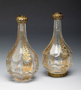 Pair of perfumers in SAINT LOUIS crystal. France, ca. 1910. Cut crystal. Fine gold. Provenance:: Pair of perfumers in SAINT LOUIS crystal. France, ca. 1910. Cut crystal. Fine gold. Provenance: Spanish private collection, formed between 1970 and 1995. The stoppers and a gilt metal base are