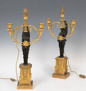 Pair of candlesticks, Empire period; c. 1810. Gilt and blued bronze. electrified.: Pair of candlesticks, Empire period; c. 1810. Gilt and blued bronze. Electrified. Measurements: 58 x 29 x 12 cm (x2). Pair of candelabras that present the same structure that is supported on a gilded