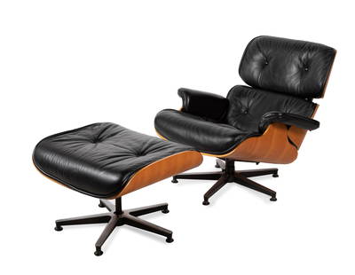 CHARLES EAMES (USA, 1907 - 1978) & RAY EAMES (USA, 1912 - 1988). "Lounge Chair & Ottoman", design: CHARLES EAMES (USA, 1907 - 1978) & RAY EAMES (USA, 1912 - 1988). "Lounge Chair & Ottoman", design 1956. Edition 1990s. Cherry wood frame with black leather upholstery. Incision in the back of the