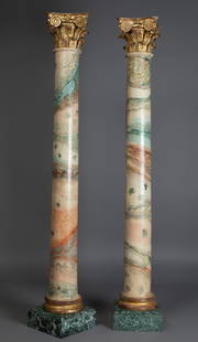 Pair of Corinthian columns, Baroque period. Late 17th century, early 18th century. Polychrome wood: Pair of Corinthian columns, Baroque period. Late 17th century, early 18th century. Polychrome wood emulating marble, gilded base and capital. Marble pedestals, later period. Faults in the wood and
