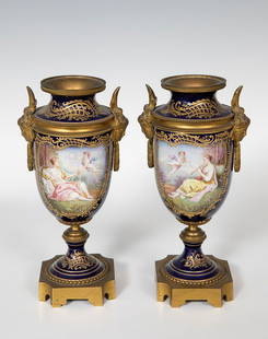 Pair of jars; SÃ¨vres, late 19th century. Porcelain and bronze. Signed Feccalti. The cap is missing.: Pair of goblets; SÃ¨vres, late 19th century. Porcelain and bronze. Signed Feccalti. With felling loss (x2). Measurements: 24 x 13 cm (x2). Pair of Sevres goblets polychrome with the characteristic