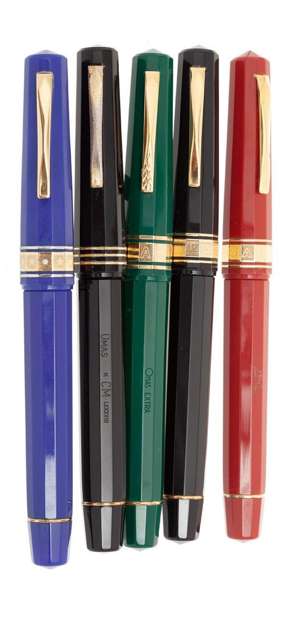 OMAS PARAGON FOUNTAIN PENS. Body in colored resins. Three 18 Kt gold nibs, F, M and M nibs; and two (1 of 5)