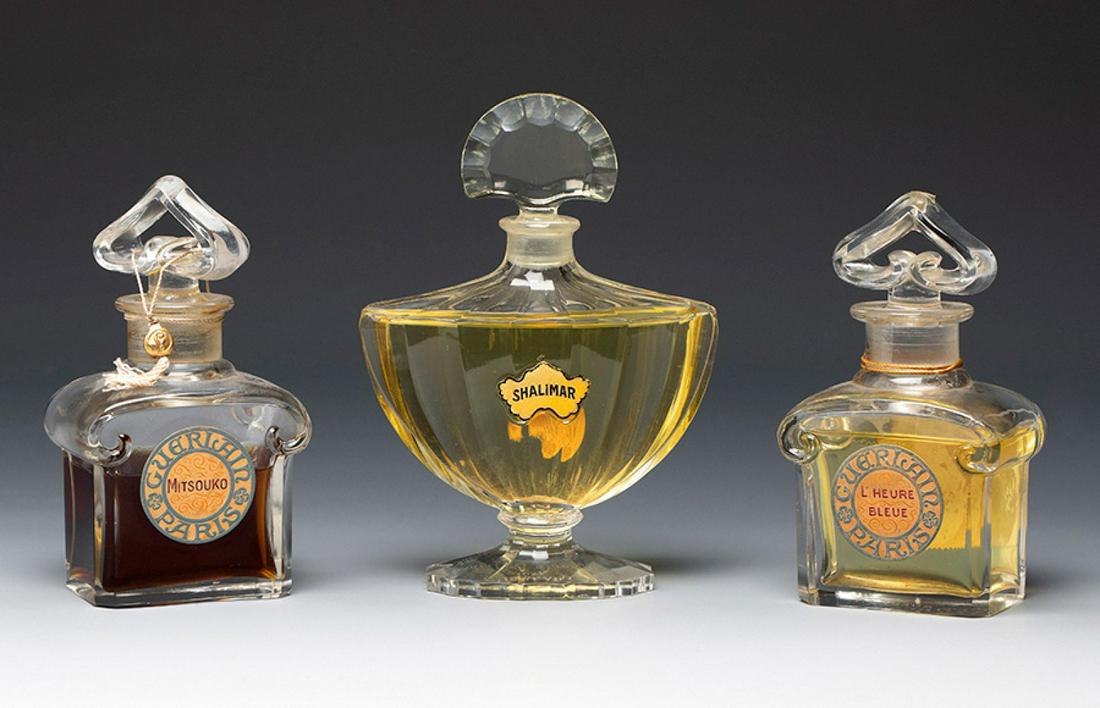 Baccarat for GUERLAIN. France, ca. 1920-30. Three Guerlain fragrance perfume bottles. Moulded glass. (1 of 5)