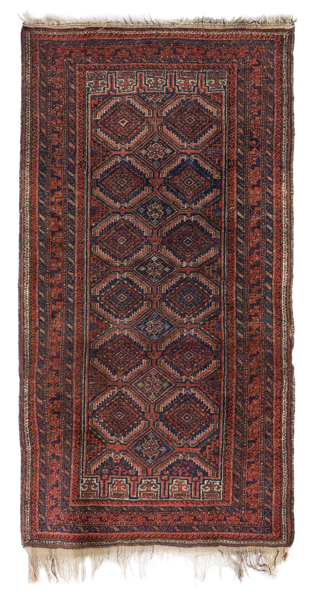 Baluch carpet. Pakistan, 19th century. Hand-knotted wool. Fringe losses. Wear and tear due to use (1 of 3)