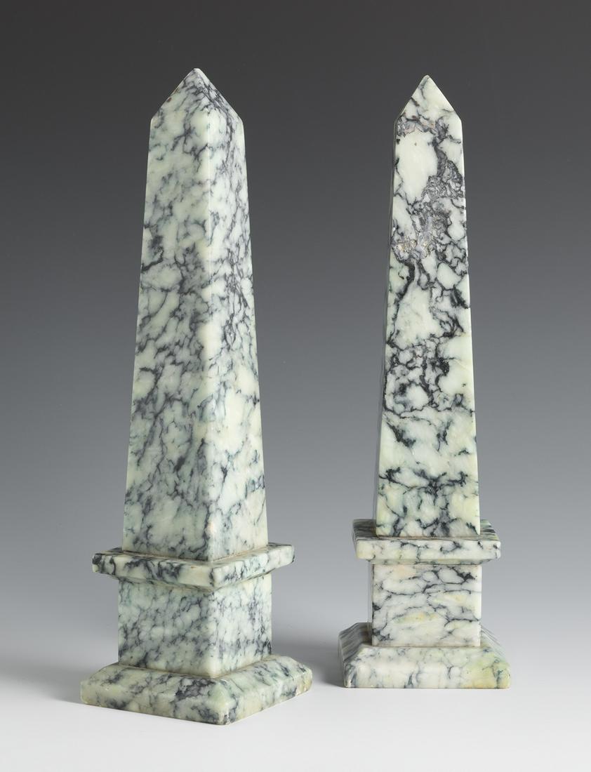 Pair of hard stone obelisks. First half of the 20th century. Hard stone, greyish colour and black: Pair of hard stone obelisks. First half of the 20th century. Hard stone, greyish colour and black vein. Very slight chipping. Measurements: 27 x 7.5 x 7.5 cm. The obelisk is a decorative piece that is