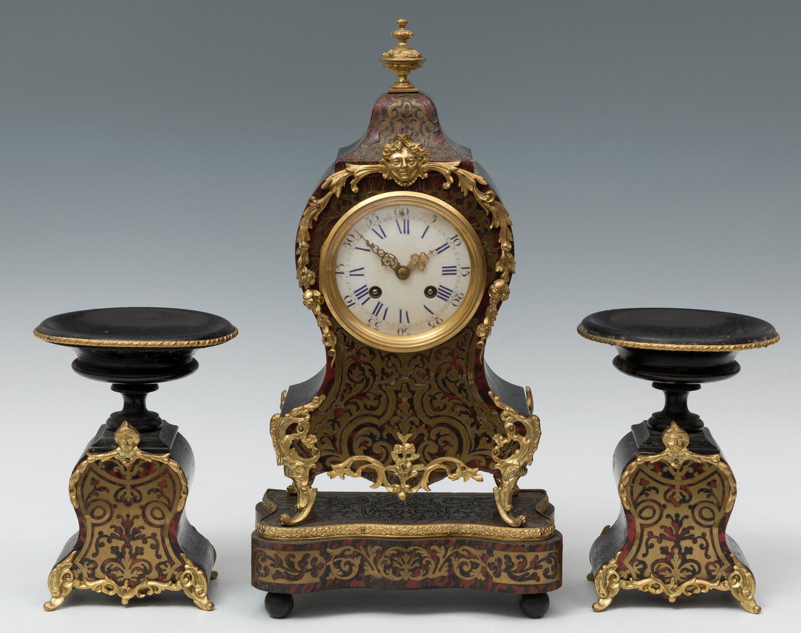 Boulle style clock with garnish; France, late 19th century. Gilt bronze, ebonized wood and marquetry (1 of 6)
