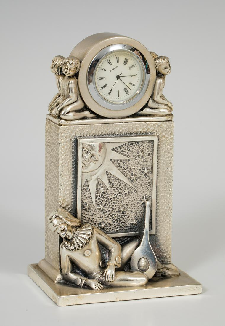 OTTAVIANI table clock in sterling silver. Second half of the twentieth century. Representing a (1 of 6)