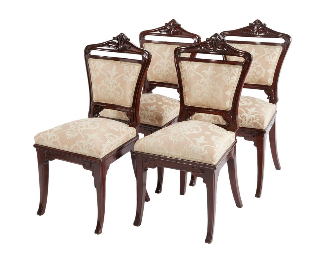 Set of four Victorian chairs; England, late 19th century. Carved mahogany wood. (1 of 3)