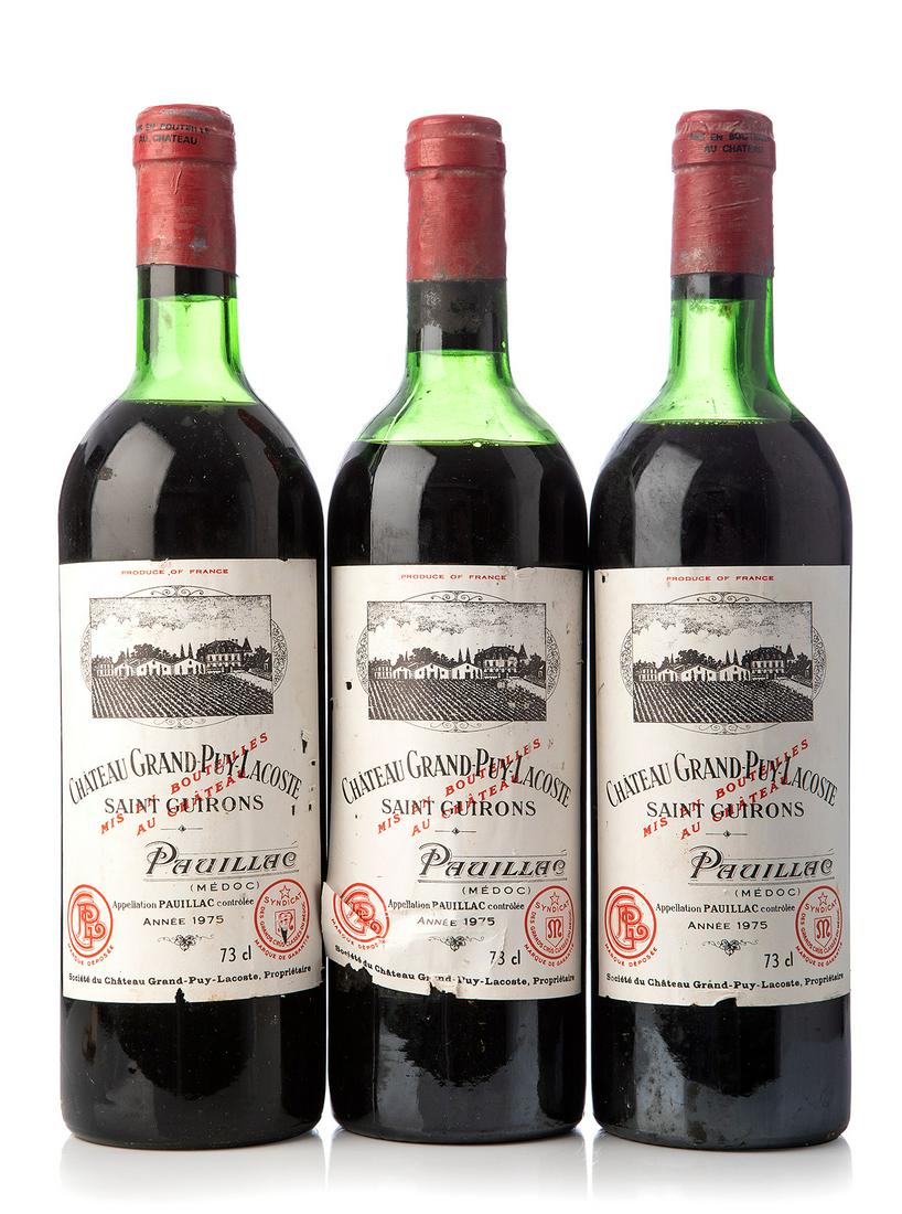 Three bottles ChÃ¢teau Grand-Puy-Lacoste 1975, Pauillac, France. Category: red wine. 73 cl. The: Three bottles ChÃ¢teau Grand-Puy-Lacoste 1975, Pauillac, France. Category: red wine. 73 cl. The labels are damaged. Level: D/E. The history of Grand-Puy-Lacoste is fascinating in many ways. It is a