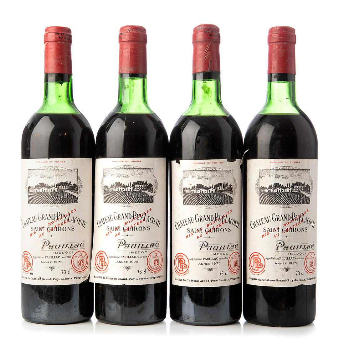 Four bottles ChÃ¢teau Grand-Puy-Lacoste 1975, Pauillac, France. Category: red wine. 75 cl. The: Four bottles ChÃ¢teau Grand-Puy-Lacoste 1975, Pauillac, France. Category: red wine. 75 cl. The labels are damaged. Level: D. The history of Grand-Puy-Lacoste is fascinating in many ways. It is a fam