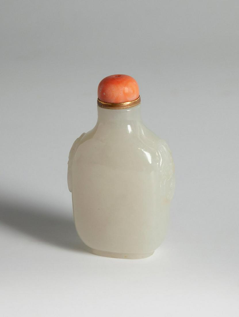 Snuff bottle. China, Qing Dynasty, 19th century.  Jade bottle. Coral stopper.  With marks of use. (1 of 5)