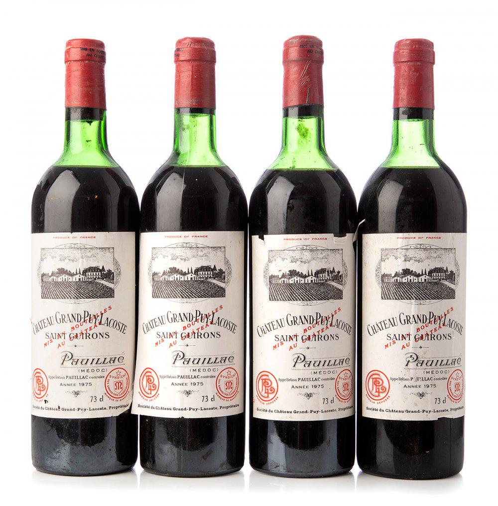 Four bottles ChÃ¢teau Grand-Puy-Lacoste 1975, Pauillac, France. Category: red wine. 75 cl. The: Four bottles ChÃ¢teau Grand-Puy-Lacoste 1975, Pauillac, France. Category: red wine. 75 cl. The labels are damaged. Level: D. The history of Grand-Puy-Lacoste is fascinating in many ways. It is a fam