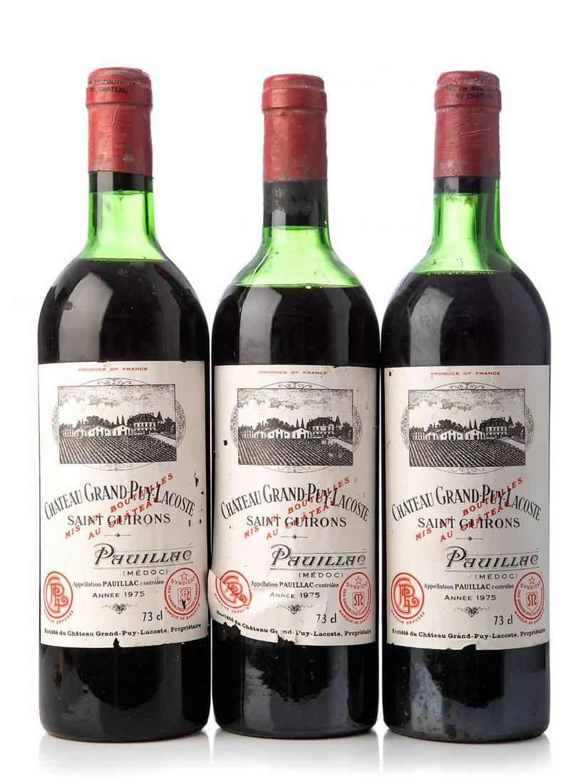 Three bottles ChÃ¢teau Grand-Puy-Lacoste 1975, Pauillac, France. Category: red wine. 73 cl. The: Three bottles ChÃ¢teau Grand-Puy-Lacoste 1975, Pauillac, France. Category: red wine. 73 cl. The labels are damaged. Level: D/E. The history of Grand-Puy-Lacoste is fascinating in many ways. It is a