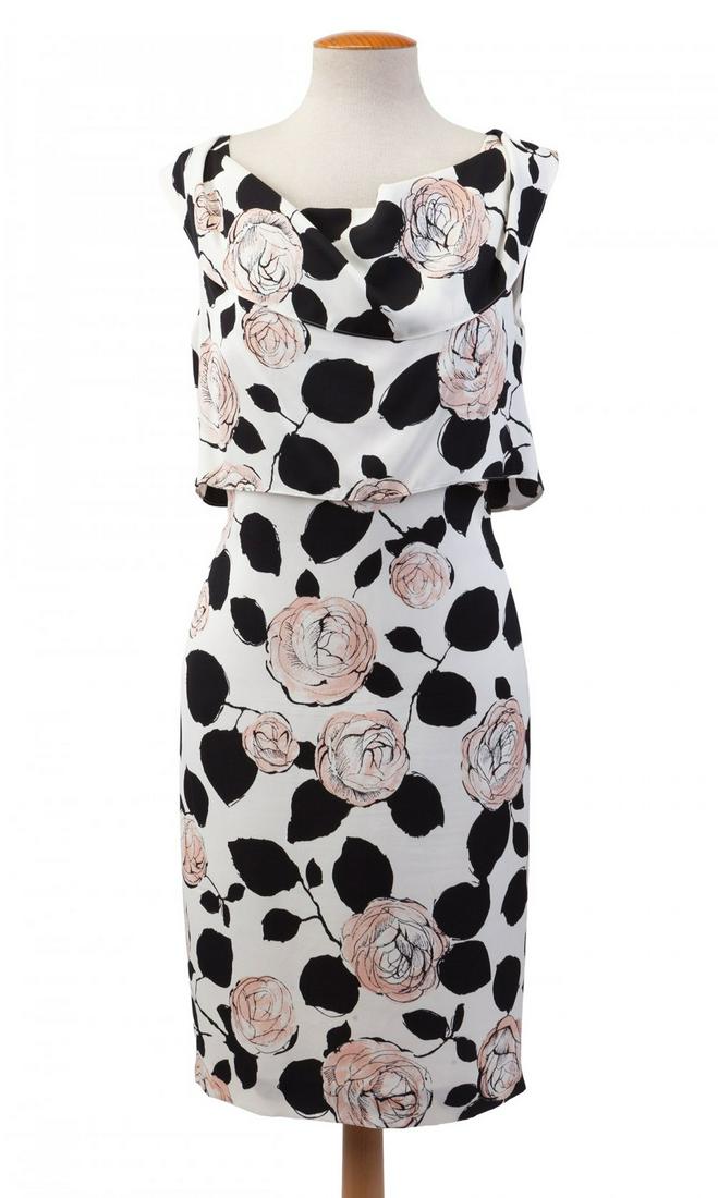 ESCADA. Boat neck silk dress with turn up. Loose body and pencil skirt. Floral print in pink and: ESCADA. Boat neck silk dress with turn up. Loose body and pencil skirt. Floral print in pink and black tones on a white background. Size 40.