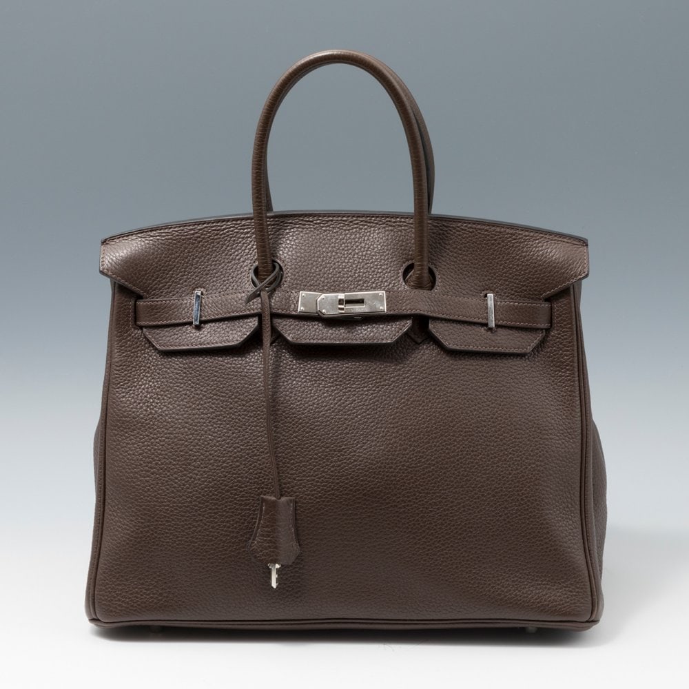 HERMÃˆS. Birkin bag 35 cm. In dark gray leather with two short handles and flap closure, secured (1 of 5)