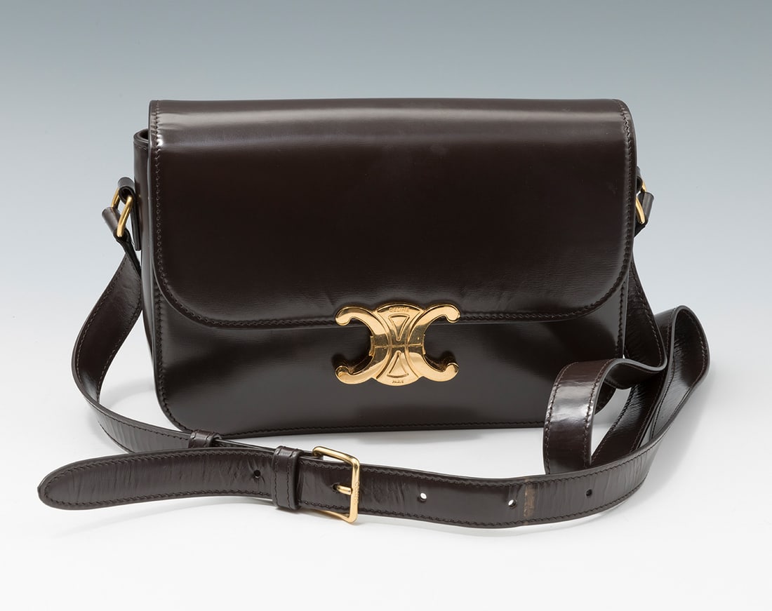 CELINE.  Triomphe shoulder bag.  Dark brown leather handbag. Front flap with Triomphe metal clasp. (1 of 4)