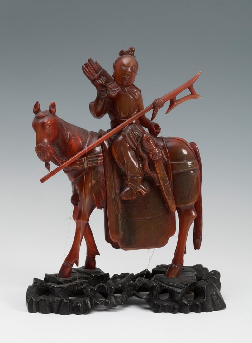 Warrior on horseback. Qing Dynasty, late 19th-early 20th century. Carved in amber.  Provenance: (1 of 3)