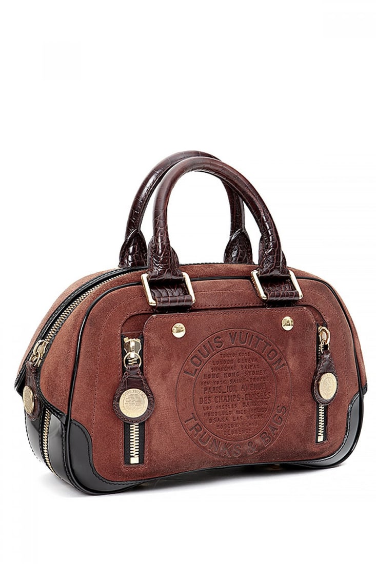 LOUIS VUITTON. Havana Stamped Trunk. Limited edition.: LOUIS VUITTON. Havane Stamped Trunk. Limited Edition. In caldera suede. Short non-adjustable handles. With gold-tone motifs. With outside pockets. Zip closure. Inside in monogram fabric. Measurements:
