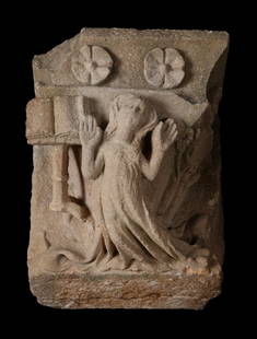 Gothic capital; Catalonia circa 1400. Carved stone. Breakage in the lectern.: Gothic spire; Catalonia circa 1400. Carved stone. Crack in the lectern. Measures: 40 x 88 x 49 cm. Carved panel in which the passage of the Annunciation is schematically represented. In a schematic ma