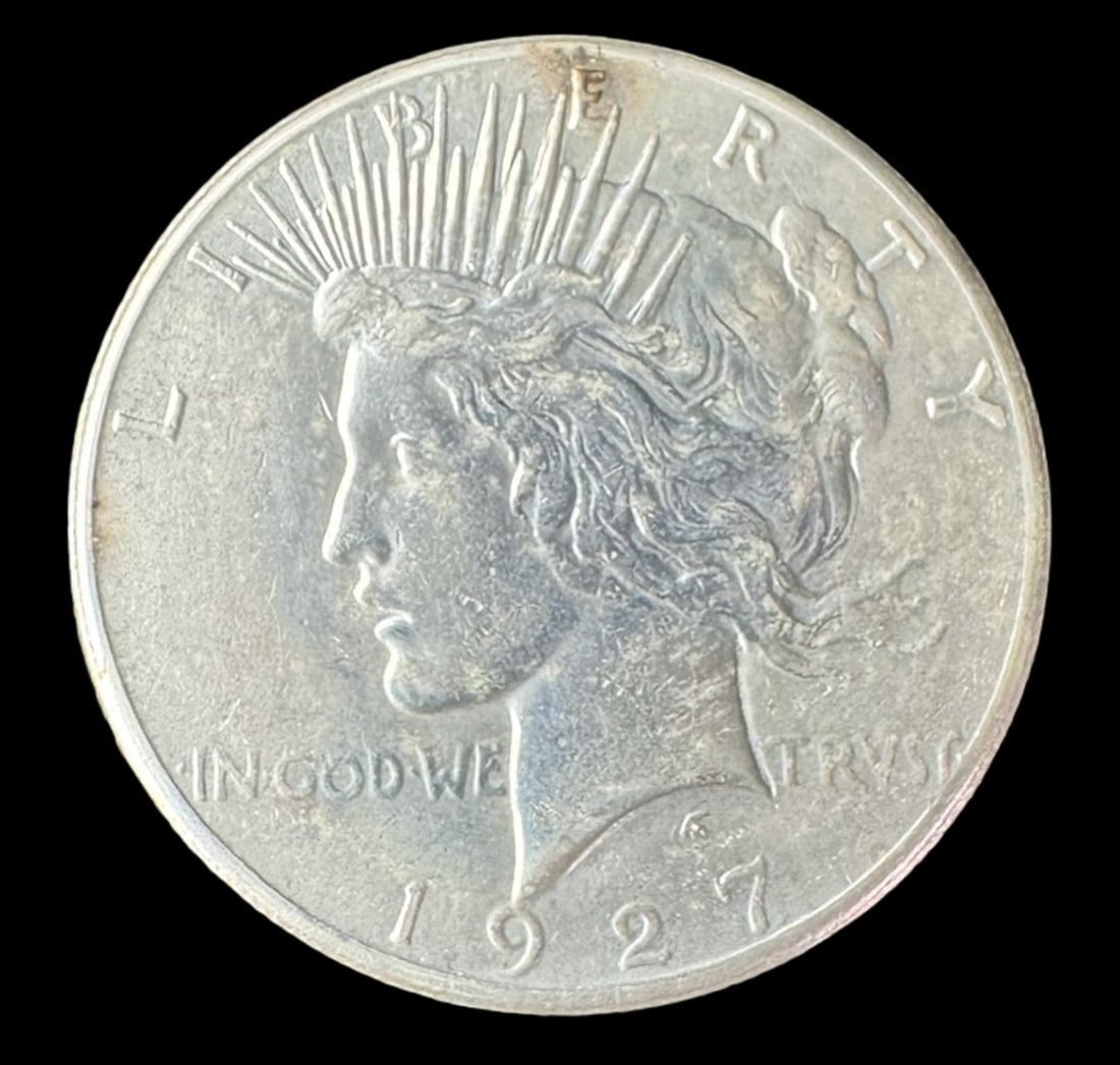 1927 Peace Silver Dollar Low Mintage: The 1927 Peace dollar is a low mintage coin, with a semi-key date. This coin is ungraded. The silver content is 90%. [CF]