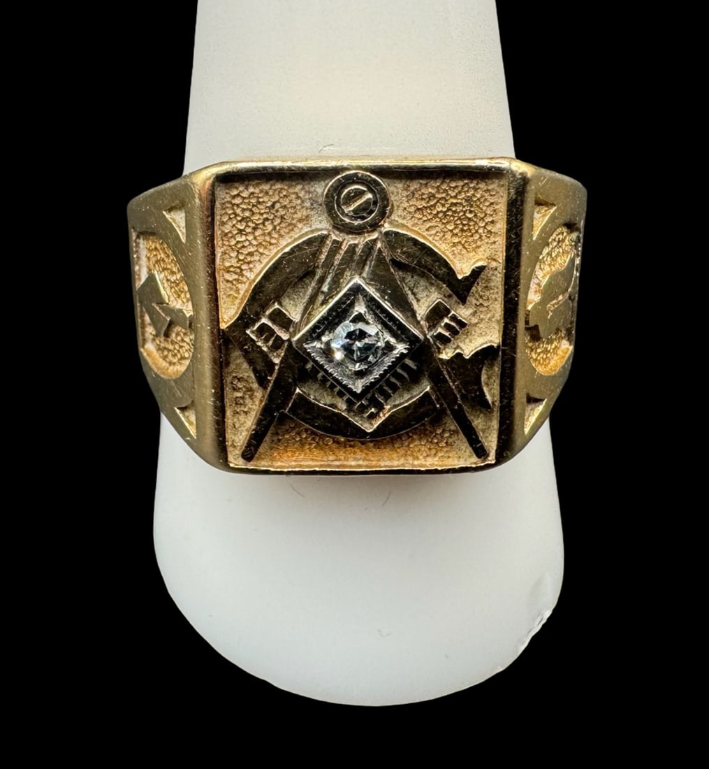 14K Gold Masonic Ring: This 14K gold Masonic ring serves as a classic fraternal symbol, with deep historical iconography. It features a diamond at the center, with traditional symbols on the top and sides. The ring size is 