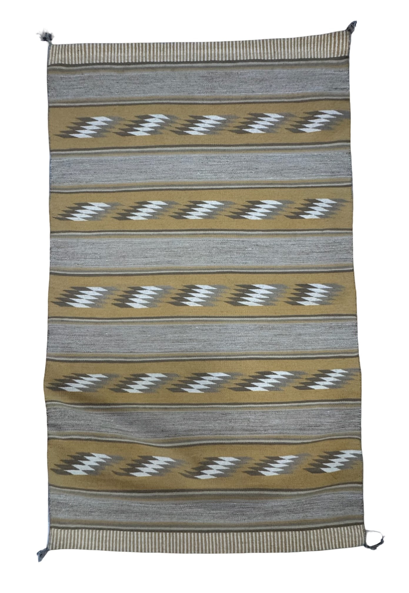 Vintage Navajo Regional Flatweave Rug: This Navajo rug is characterized by alternating horizontal bands, plain stripes, and a repeating serrated or squiggly geometric motif. It is dominated by warm ochre-yellow, sandy tans, cream, and gray