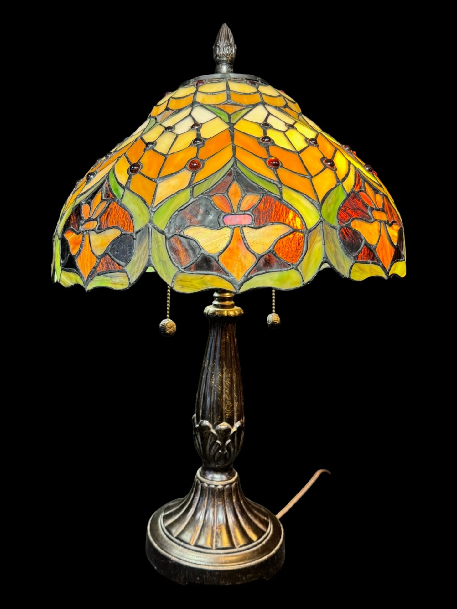Tiffany Style Stained Glass Lamp: This is a Tiffany style stained glass lamp with Victorian Serenity. The maker is unknown. There are no obvious chips or cracks in the shade. The lamp is working at the time of catalog. [PW]