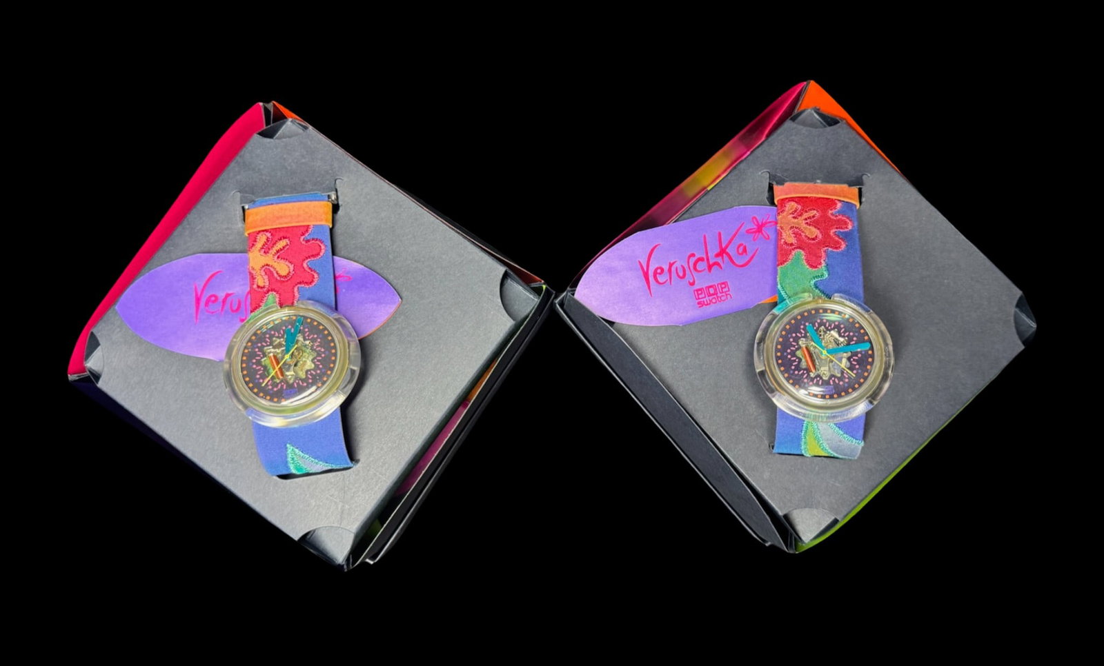 NOS 1991 Swatch Veruschka POP PWZ103 Watches: This assortment includes a pair of 1991 Swatch Veruschka watches in the original boxes. Confetti, instructions, bow, and original overwrap is included with each. The batteries were removed at