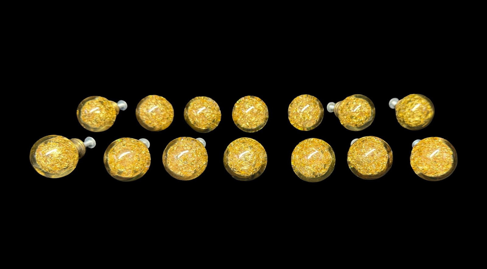 MCM Gold Leaf Flake Cabinet Pulls by Ruth Richmond: These cabinet pulls were designed by well-known mid-century architect and designer Ruth Richmond for Weiser. The clear molded cabinet pulls are packed with dense metallic gold leaf-like flakes, and
