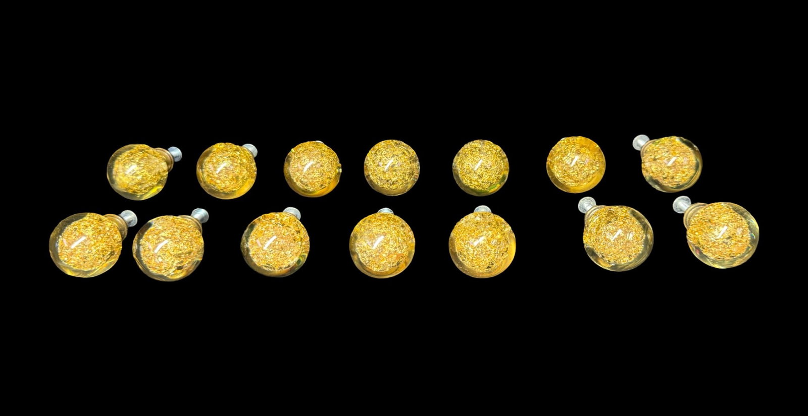 MCM Gold Leaf Flake Cabinet Pulls by Ruth Richmond: These pieces were designed by well-known mid-century architect and designer Ruth Richmond for Weiser. The clear molded cabinet pulls are packed with dense metallic gold leaf-like flakes and fitted