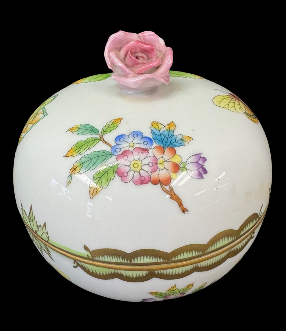 Vintage Herend Hand Painted Porcelain Bonbonniere: This vintage Herend hand-painted porcelain bonbonniere is in the highly collectible Queen Victoria pattern characterized by colorful peony blossoms, vibrant butterflies, and gilded apple-green
