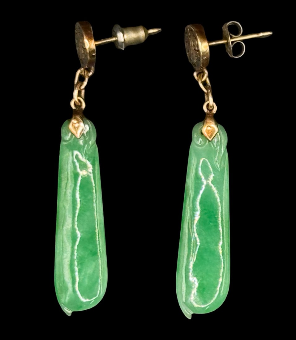 14K Gold Chinese Jade Dangle Earrings: This is a pair of Chinese green jade dangle earrings styled with 14K yellow gold settings. They are stamped “14K, KJ.” The round studs at the top feature the Chinese character for Fu, which re