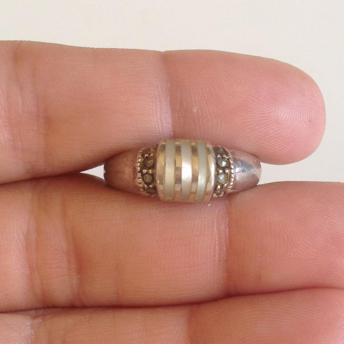 Vintage sterling silver ring MOP, marcasites: Vintage sterling silver ring with mother of pearl and marcasites size 7 1/2. Weight 2.94 grams. Hallmark 925 MAN. Condition excellent.
