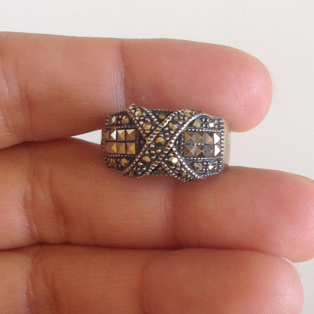 Vintage sterling silver ring with marcasites size 6 3/4: Vintage sterling silver ring with marcasites size 6 3/4. Weight 5.52 grams. Hallmark CW 925. Condition excellent.