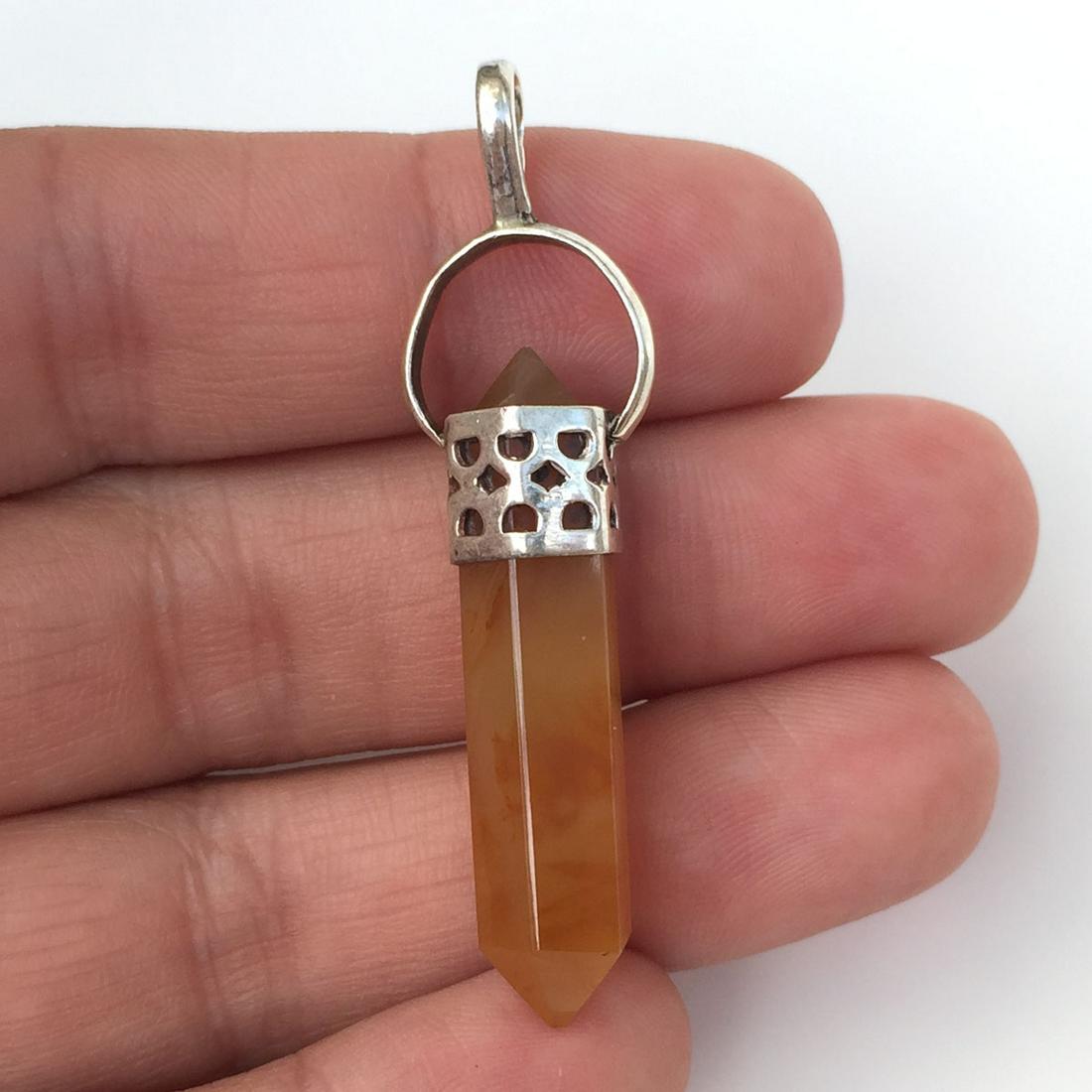 Sterling silver hexagon shape carnelian pendant: Sterling silver hexagon shape carnelian pendant. Weight 5.02 grams. No hallmark, tested 925. Length 2 inches with bail. Condition very good.