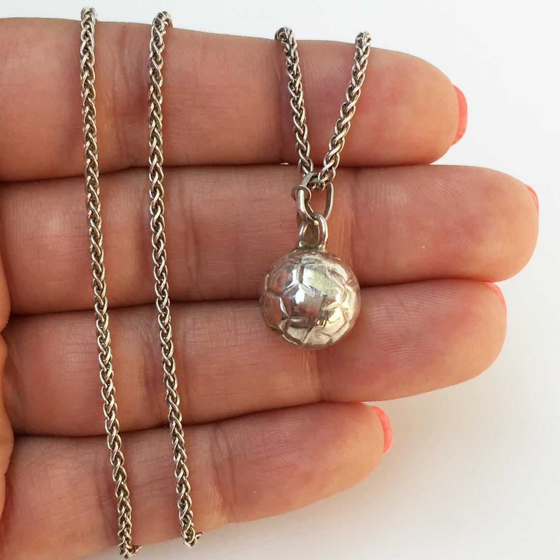 Sterling silver Soccer ball pendant wheat chain: Sterling silver Soccer ball pendant wheat chain. Weight 6.95 grams. Hallmarked 925 ITALY. Chain length 18 inches. Pendant length 3/4 inches with bail. Condition excellent.