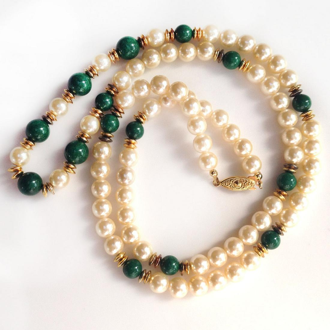 Vintage gold tone faux pearl green beads necklace: Vintage gold tone cream color faux pearl and green malachite color beads necklace 32 1/2 inches. Faux pearls approximately measured 8 mm in diameter. Length 32 1/2 inches. Condition excellent.