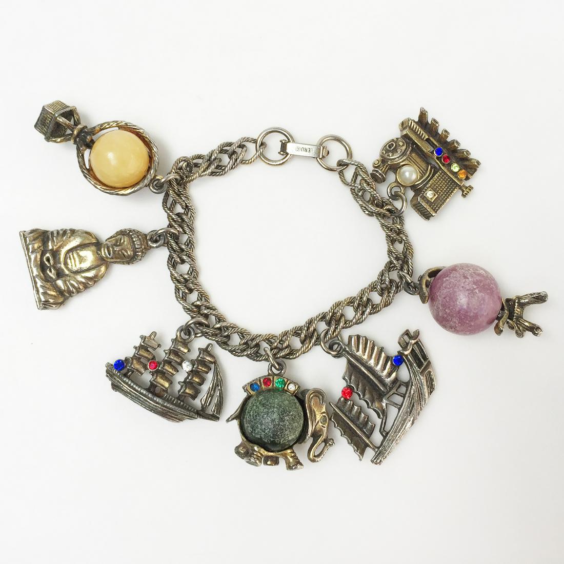 LERU Vtg Around the world in 80 days charm bracelet: LERU Vintage gold tone "Around the world in 80 days" multicolor crystals and round beads charm bracelet, signed. Charms are: Hot air balloon, Train, Globe, Elephant, Japanese sail ship, Sail ship, Asi