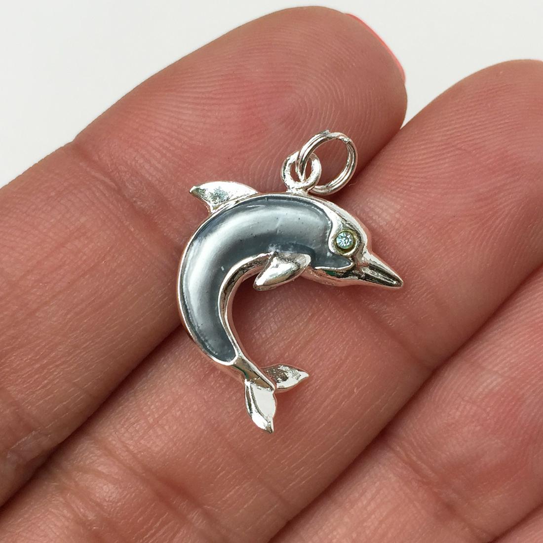 Sterling silver enamel crystals Dolphin charm pendant: Sterling silver enamel crystals Dolphin charm pendant. Weight 2.45 grams. Hallmarked 925. Length 1 inch with bail. Condition excellent.