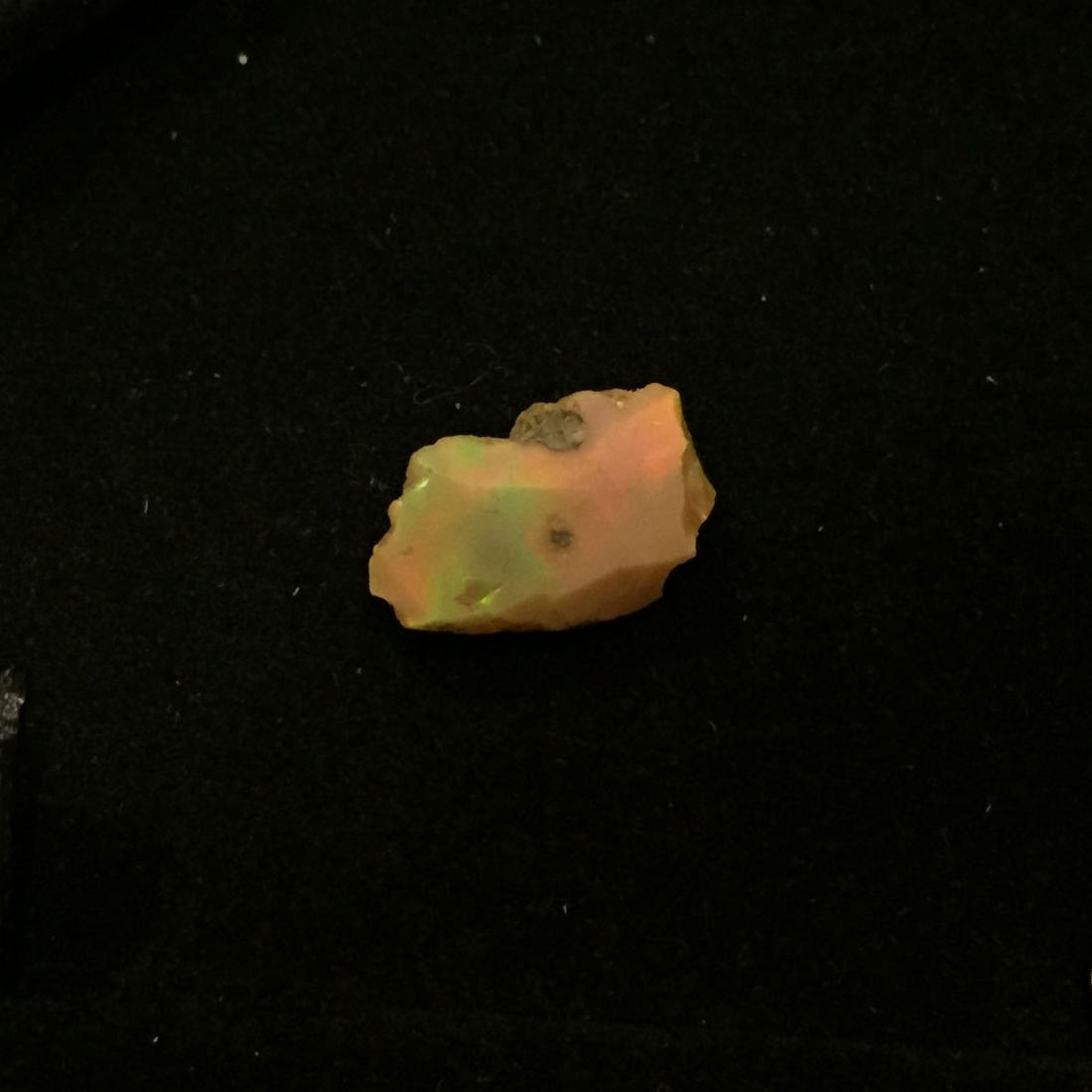 Rough raw Ethiopian Welo opal, weight 6.80 ct: Rough raw Ethiopian Welo opal, weight 6.80 ct. Measured approximately 17.5 mm x 10.7 mm. Opal has very nice play of colors. Country of origin Ethiopia, Africa.