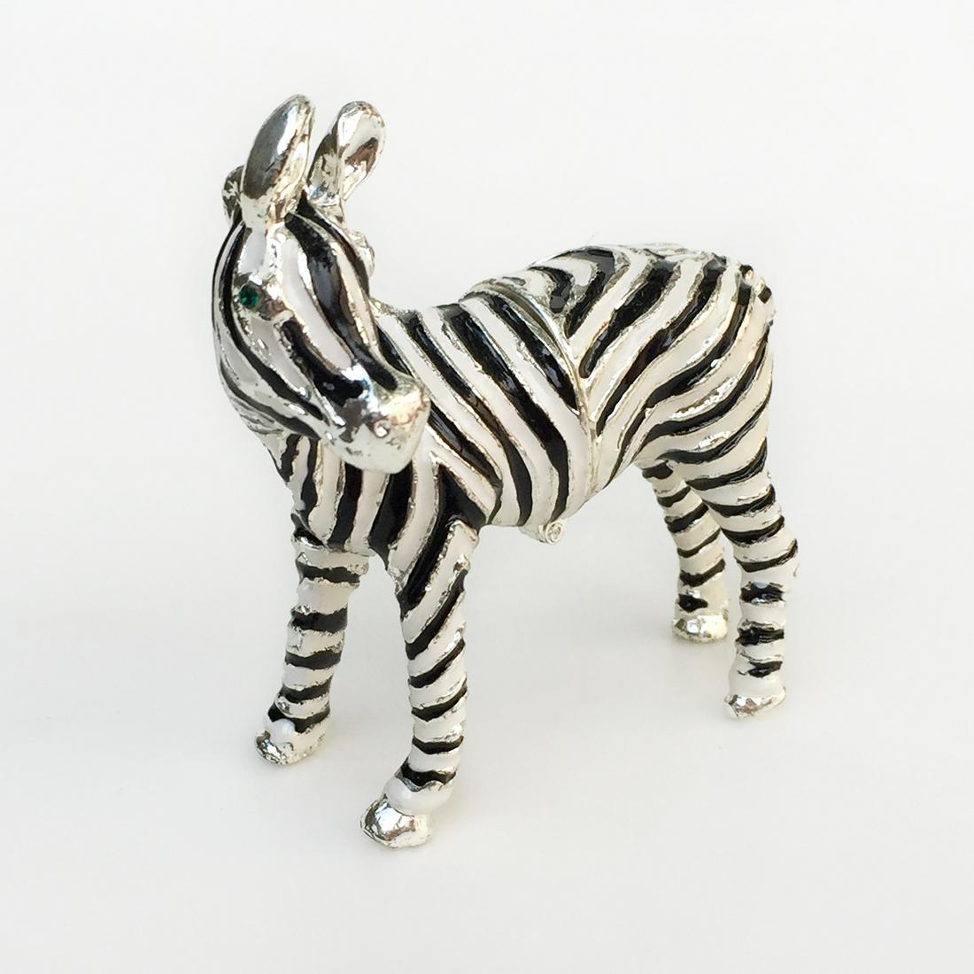 Enamel crystals Zebra trinket jewelry box: Enamel crystals black and white Zebra trinket jewelry box. Measured 1 1/2 x 3 1/4 x 3 1/8 inches. Condition very good.